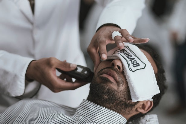 beard getting trimmed by a barber