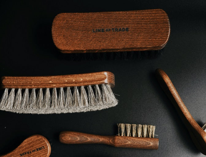 different hair brushes on a table